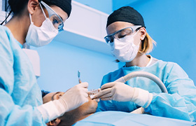 dentist performing advanced dental implant procedure in DeLand