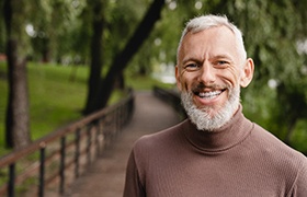 man smiling with dental bridges in DeLand