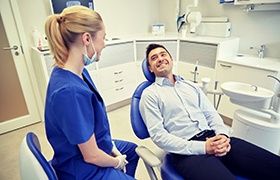 man getting a dental checkup and teeth cleaning in Deland