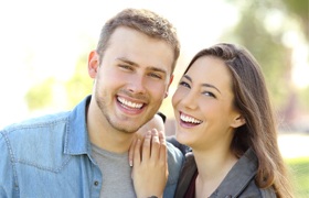 Couple with tooth colored fillings smiling together