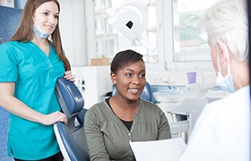 Dental implant dentist in DeLand speaking with patient about dental implants