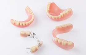 A variety of dentures on a white background