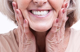 closeup of woman smiling with dentures 
