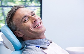 Man with dentures in DeLand smiling
