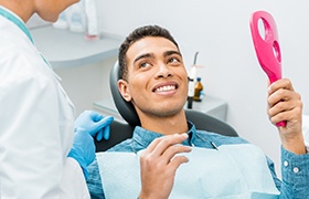 a patient speaking with their emergency dentist in DeLand