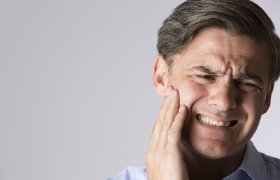 Man with tooth pain before emergency dentistry in DeLand