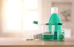 Series of oral care products resting on a table