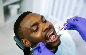 Patient having his dental implants in DeLand examined by dentist