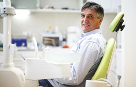 Man with dental implant dentures in DeLand, FL visiting dentist