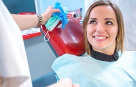 Woman in dentist’s chair using her dental insurance in Deland