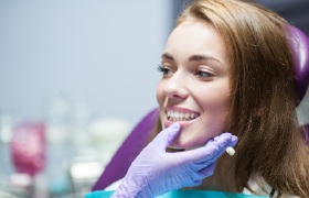 Dentist examining patient’s bite during custom nightguard fitting