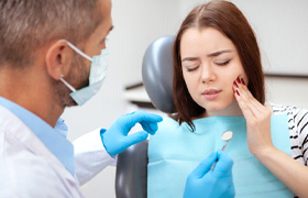 young woman visiting her emergency dentist 