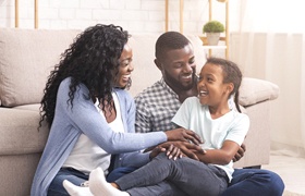 Family laughing together after child received dental sealants