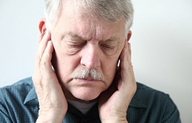 Man experiencing jaw pain