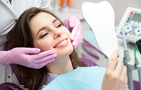 patient smiling while visiting cosmetic dentist 