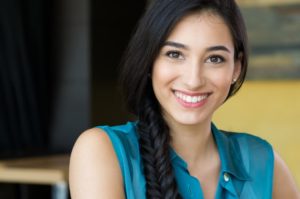 Woman smiling confidently.