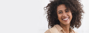 attractive woman curly hair smiling