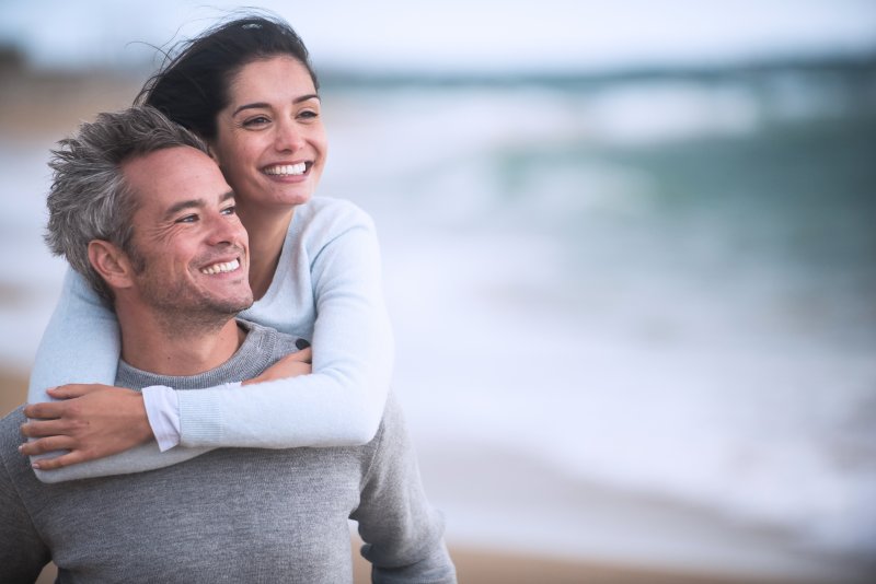 Older couple smiling after using tax refund on their smile