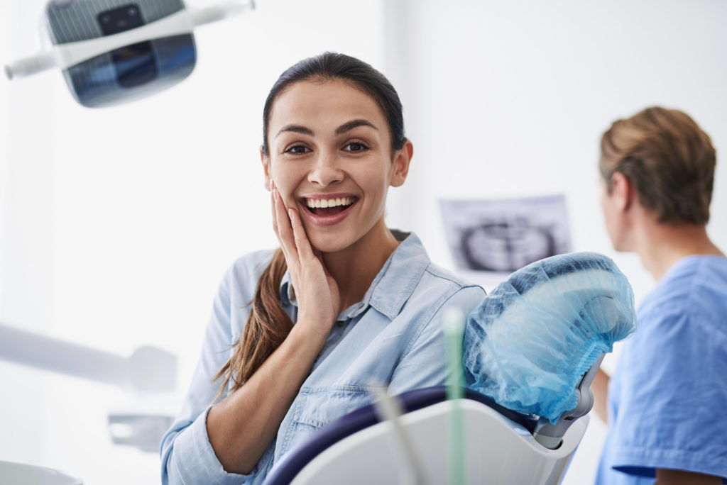 patient smiling after a dental emergency in DeLand
