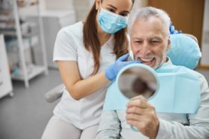 Patient at the dentist after receiving a full denture