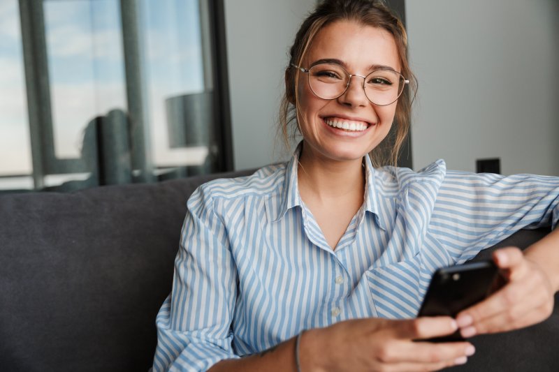 person with dental implants smiling