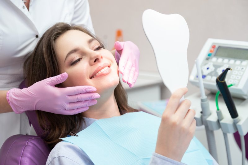 woman smiling while visiting dentist 