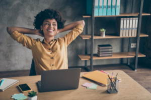 a patient smiling while sitting at a desk